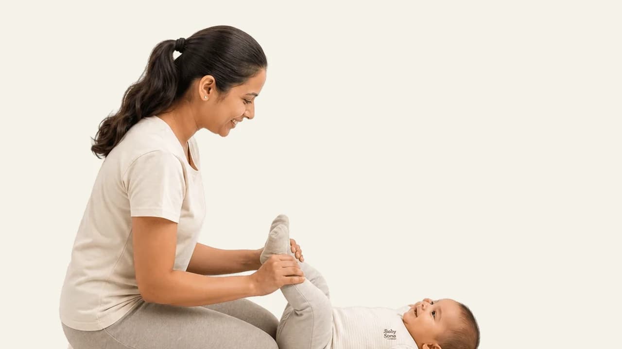 A parent doing gentle activity with a baby during an age-appropriate awake window