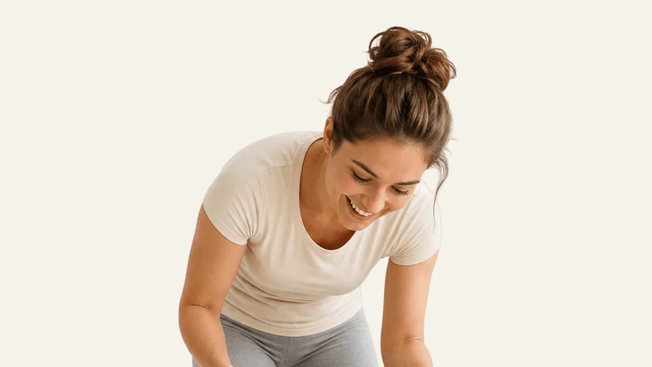 A parent doing gentle morning exercises with a baby as part of a daily rhythm