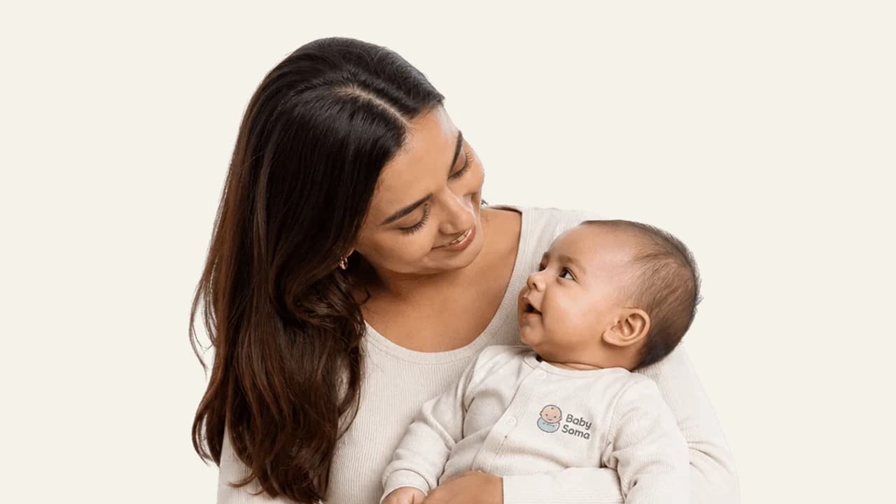 A parent softly singing an evening lullaby to settle a baby for the night